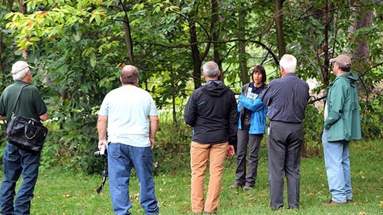 Dr. Beth Brantley shows members of the Cumberland Woodland Owners Association a grove of Chinese chestnut and American chestnut trees on the Penn State Mont Alto campus.